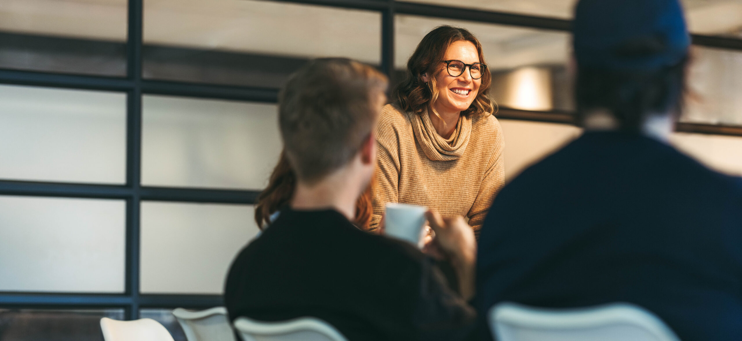 Group,Of,Colleagues,Engages,In,A,Dynamic,Discussion.,A,Confident